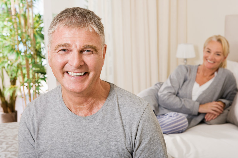 Mature couple in bedroom smiling and happy because he's gotten the P-Shot in Kansas City.