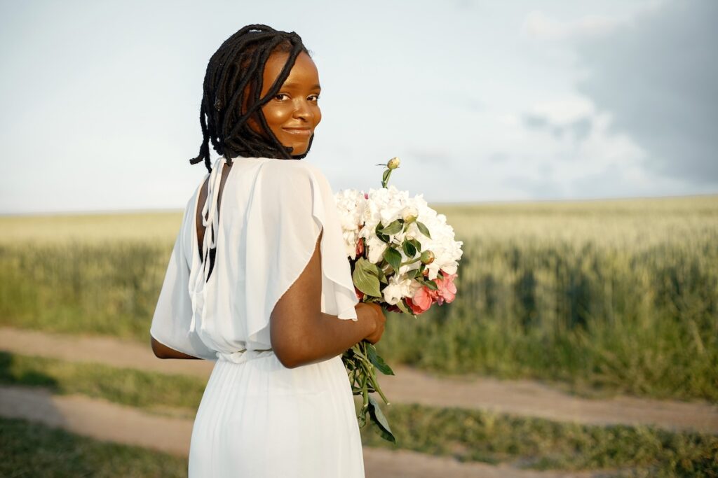 Bride smiling on her wedding day after coming to Regain for bridal cosmetic treatments in Leawood