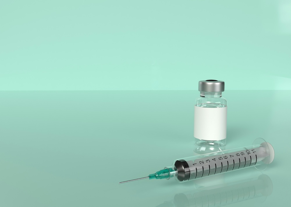Unidentified bottle and syringe